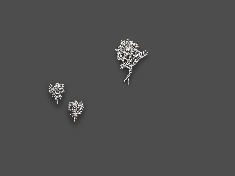 A Set Of "Flower" Diamond Brooch And Ear Clips Designed as an openwork flower and leaves" brooch,