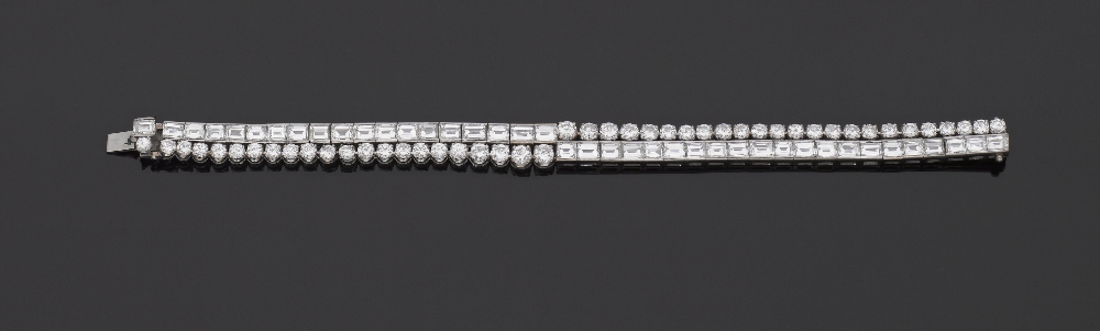 A Diamond Double-Line Bracelet Designed as two lines of baguette and circular-cut diamonds,