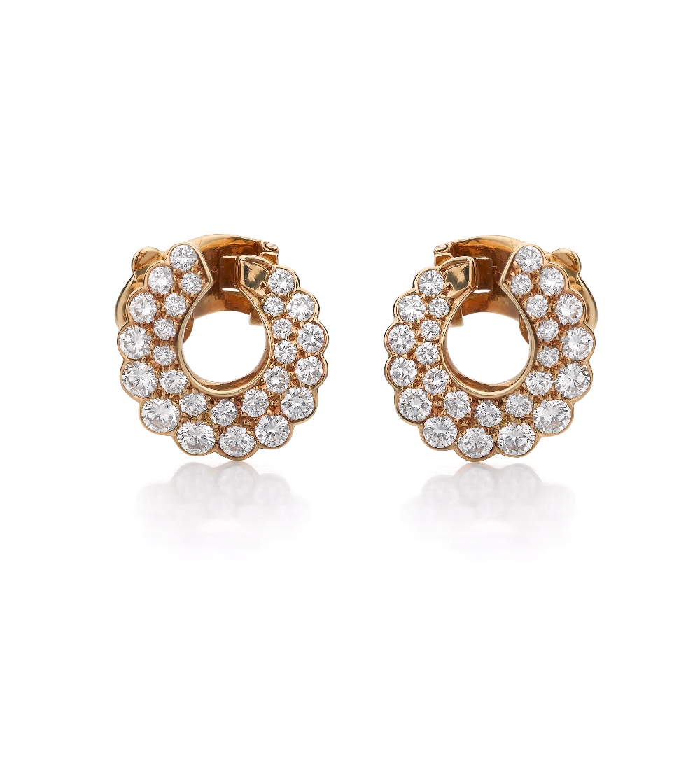 A Pair Of Diamond Ear Clips, by VAN CLEEF & ARPELS Each designed as a scrolling hoop, set with