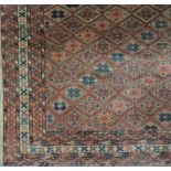 An antique Oriental pink ground Rug, wit