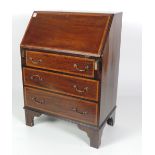 A small inlaid mahogany slope top Bureau