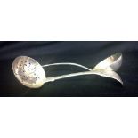 An attractive Sifter Ladle, engraved wit