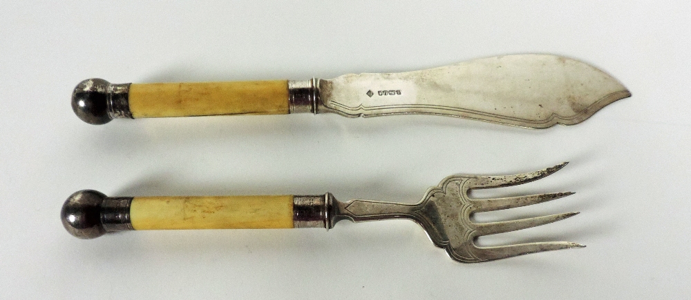 A pair of silver mounted ivory handled F