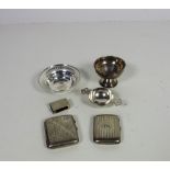 A silver Tea Strainer, two silver Cigare