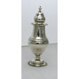 An urn shaped plain silver Sugar Shaker,