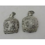 An exceptionally rare pair of elaborate early 19th Century silver plated lead heraldic Crests,