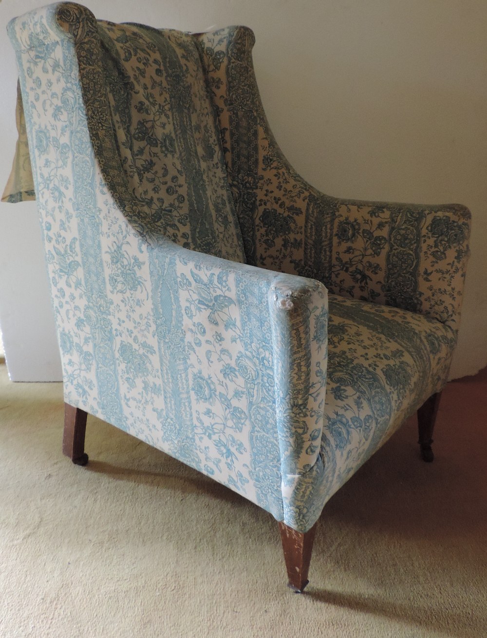 A late 19th Century Armchair, covered in