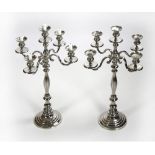 A pair of tall heavy silvered five light