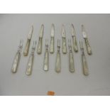 A set of 6 silver Fruit Knives and 6 mat