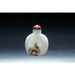 CHINESE AGATE SNUFF BOTTLE. Late 19th century. One side depicts a bird with lotus leaf. With a red