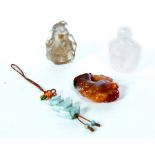 FOUR CHINESE SNUFF BOTTLES AND PENDANTS. Twentieth century. Jade drop pendant, 1.5"l., agate pendant