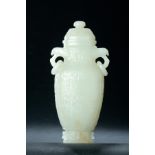 RARE WHITE NEPHRITE JADE ARCHAIC COVERED VASE. Eighteenth-19th century. Low relief carving