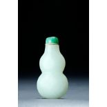 CHINESE NEPHRITE JADE GOURD SHAPED SNUFF BOTTLE. Nineteenth century. Cleanly carved with a jadeite