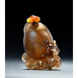 CHINESE BROWN CRYSTAL SNUFF BOTTLE WITH MONKEY. Late Qing Dynasty,19th century. Carved peach shape