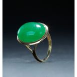 CHINESE GREEN JADEITE RING. Late 19th century. 14k gold setting. Provenance: From East Coast