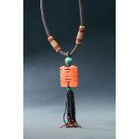 CARVED CHINESE CORAL NECKLACE. Late 19th century. Carved pendant with the character "Xe" meaning