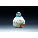 CHINESE ENAMELED GLASS SNUFF BOTTLE. Nineteenth century. Bulbous bottle depicting the flowers,