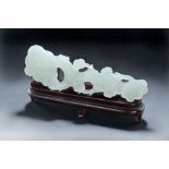 CHINESE WHITE JADE RUYI. Twentieth century. Openwork carving. 13"l. With wood stand.