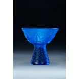 CHINESE BLUE PEKING GLASS CUP. Eighteenth-19th century. Eight Buddhist patterns surround the cup