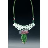 CHINESE WHITE JADE AND TOURMALINE NECKLACE. Nineteenth century. Two pieces of old open work with