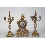 Trittico,  GEORGES VAN DER STRAETEN, composto da orologio e due candelieri in metallo dorato con