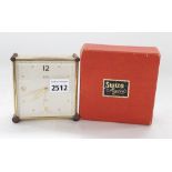 Swiza Mignon eight jewel travelling alarm clock, the 3.5" square dial within a cream case