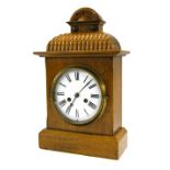 German light oak two train mantel clock striking on a gong, the 6.25" white dial within a stepped