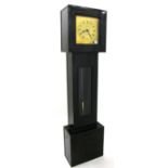 Interesting ebonised electric grandmother clock with passing strike, the 10" square brass dial