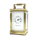 Mappin & Webb miniature carriage clock timepiece, within a brass pillared case, 4" high