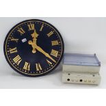 Electric 18" wall dial clock, with raised gilded Roman numerals on a cobalt blue painted convex