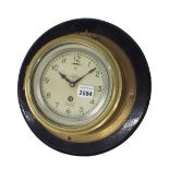 Brass single train ship's bulkhead wall clock, the 5" dial signed Mercer, St Albans, England