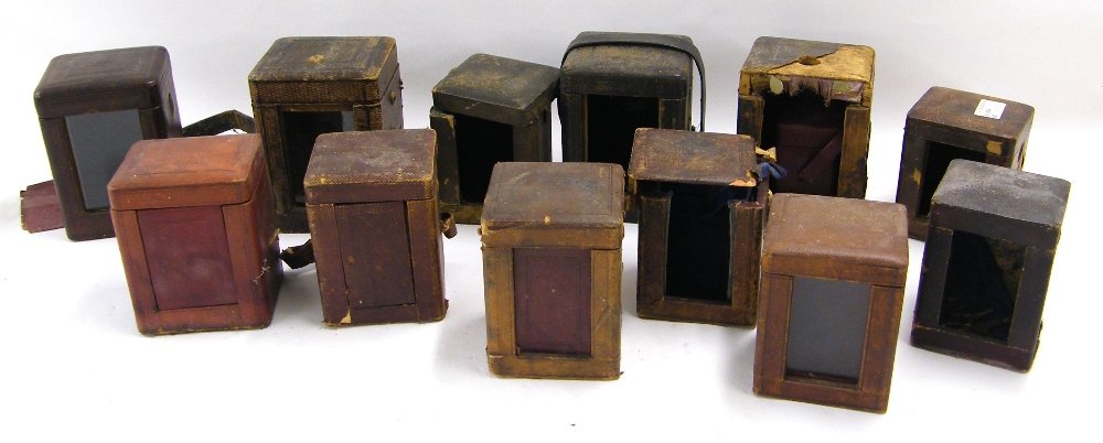Twelve leather carriage clock travelling cases, with an assortment of associated keys