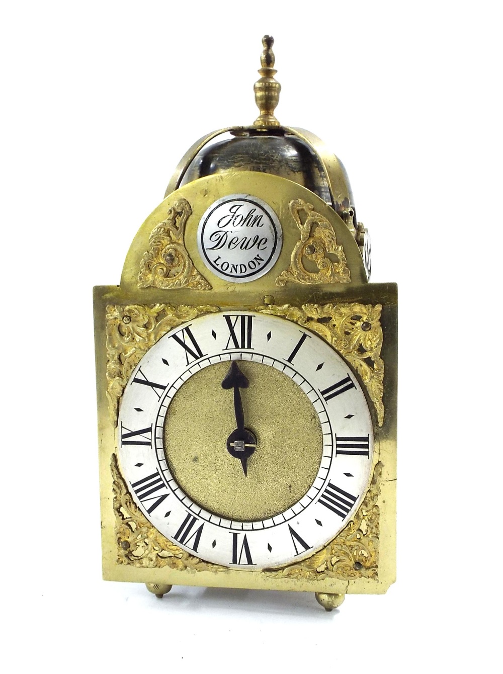 Small verge lantern clock, the 4.25" later brass arched dial signed John Dewe, London on a