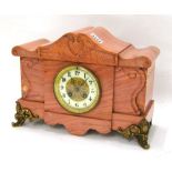 Pink marble two train mantel clock striking on a gong, the 3.5" chapter ring enclosing an ornate