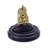 Miniature gilt metal Zappler timepiece, upon an ebonised base beneath a circular dome, clock 3"