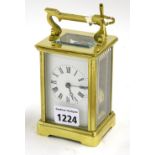 Carriage clock striking on a gong, within a corniche brass case, 6" high (key)