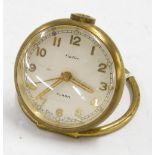 Small brass eight day alarm desk clock timepiece, the 2.25" silvered dial signed Cartier within a