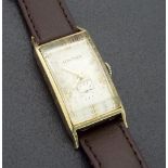 Longines 10k gold filled rectangular curvex gentleman's wristwatch, silvered dial with Roman
