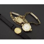 Three 9ct ladies wristwatches, one with leather strap and two gold plated bracelets to include