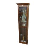 Electric master clock, within an oak glazed case, 55.5" high (pendulum)