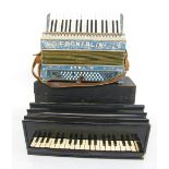 Early ebonised piano accordion inscribed Busson, Paris within a fitted wooden box; together with a