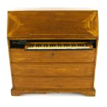 A bureau organ, north German, mid-18th century, the case of mahogany, the fall front opening to