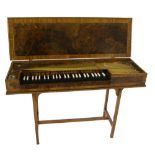 A small unfretted clavichord by Thomas Goff and Joseph Cobby, London, 1952, the case of burr
