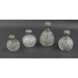 Four various silver topped cut glass scent bottles, 3.5-6" high (4)