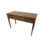 Good quality cherry wood writing table, the moulded top over three drawers flanked by fretwork