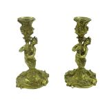 Pair of ormolu candlesticks, cast as ladies holding cornucopia shape sconces embossed with wheat