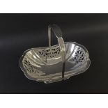 1930s silver lobed pierced basket with floral panels and hoop handle on a pedestal base, maker James