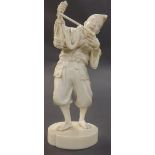 Japanese carved ivory okimono of a fisherman holding a basket with an eel, upon a circular lobed