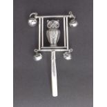 White metal pearl handled novelty baby's rattle in the form of an owl on a swing, 5" long