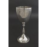 Victorian silver goblet engraved with floral and ribbon bands upon an embossed beaded and acanthus